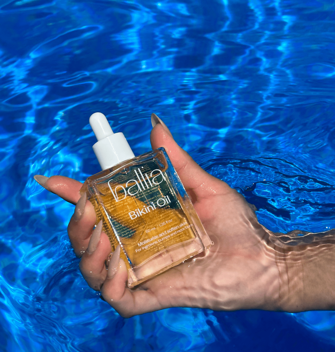 Bikini line aftershave treatment bottle to reduce and prevent ingrown hairs, red bumps, hyperpigmentation and razor burn.